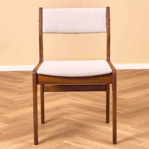 Danish dining chairs in walnut by Farstrup