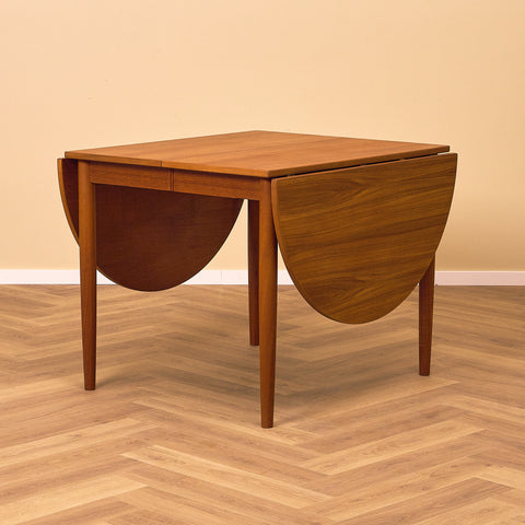 Danish dining table with 4 extensions in teak "Arne Vodder style"