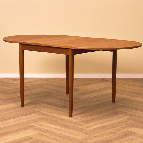 Danish dining table with 4 extensions in teak "Arne Vodder style"