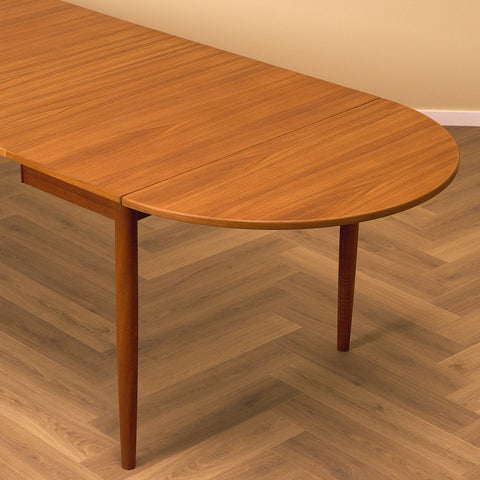 Danish dining table with 4 extensions in teak "Arne Vodder style"