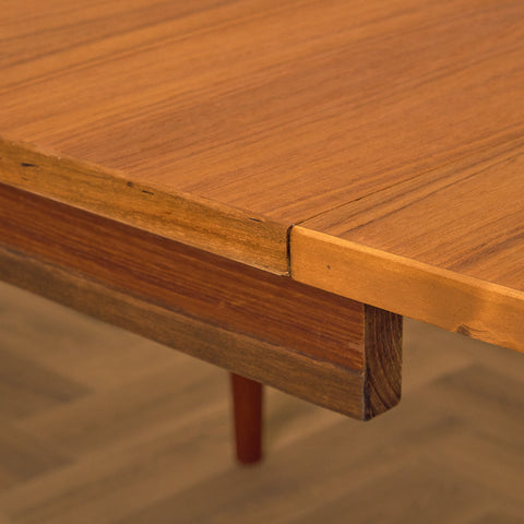 Danish dining table with 4 extensions in teak "Arne Vodder style"