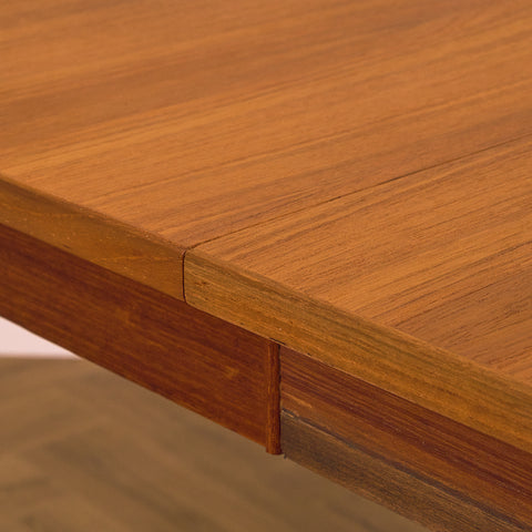 Danish dining table with 4 extensions in teak "Arne Vodder style"