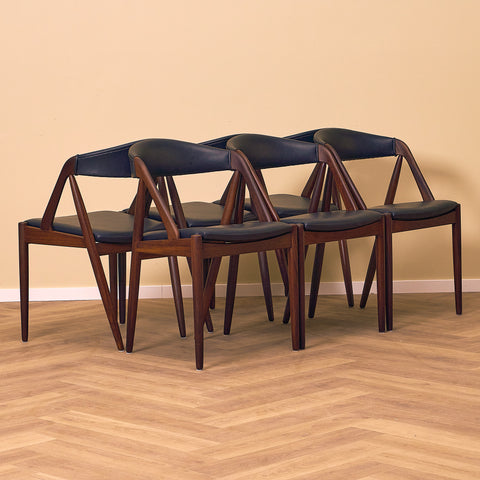 Danish dining chairs in walnut by Kai Kristiansen for Schou Andersen, model 31