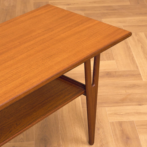 Danish coffee table in teak and walnut by Kurt Ostervig