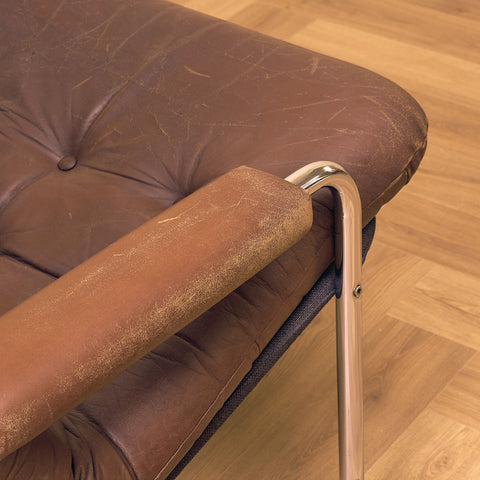 Fåtölj i läder och krom från mitten av århundradet