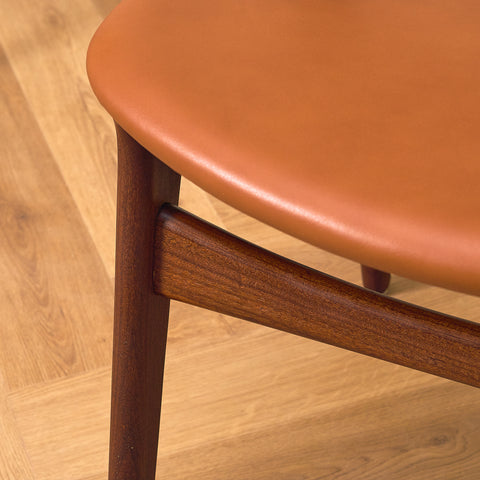 Danish dining chairs in solid walnut and teak by Erik Buch for Chr. Christensen Møbelfabrik, model 310