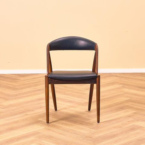 Danish dining chairs in Santos rosewood by Kai Kristiansen for Schou Andersen, model 31