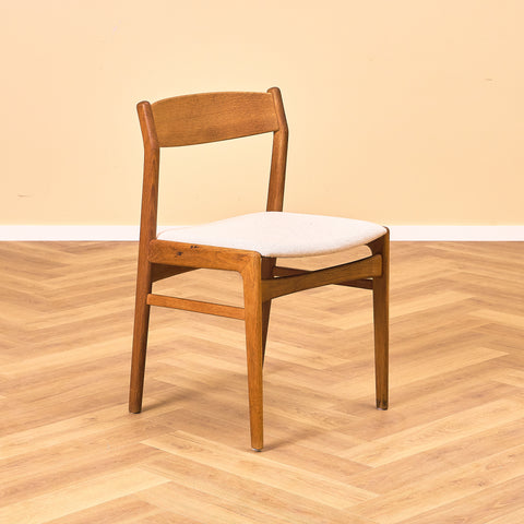 Danish dining chairs in oak by Erik Kirkegaard