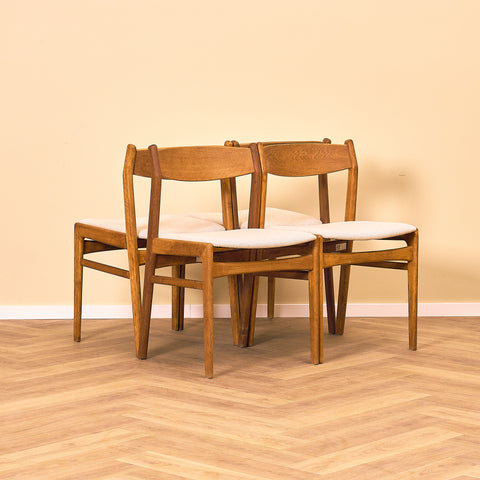 Danish dining chairs in oak by Erik Kirkegaard