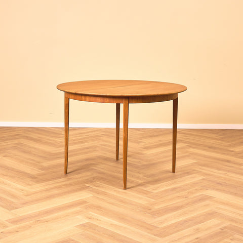 Swedish round dining table in teak and beech