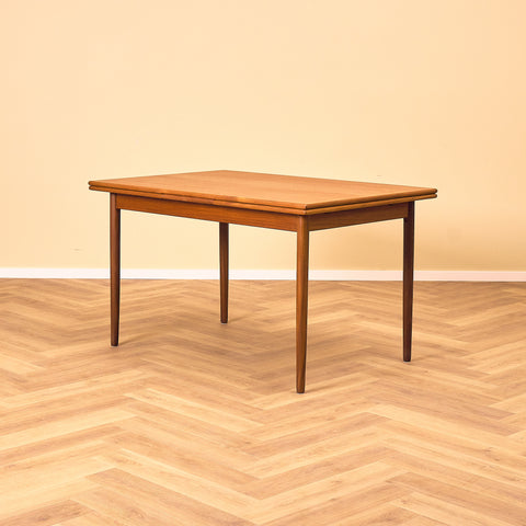 Danish dining table in teak and walnut