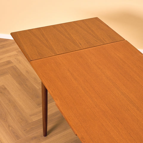 Danish dining table in teak and walnut