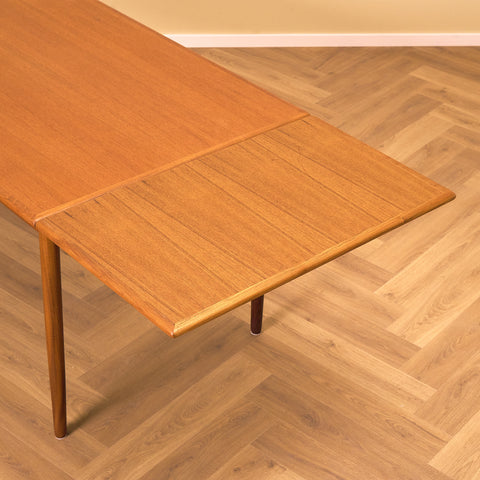 Danish dining table in teak and walnut