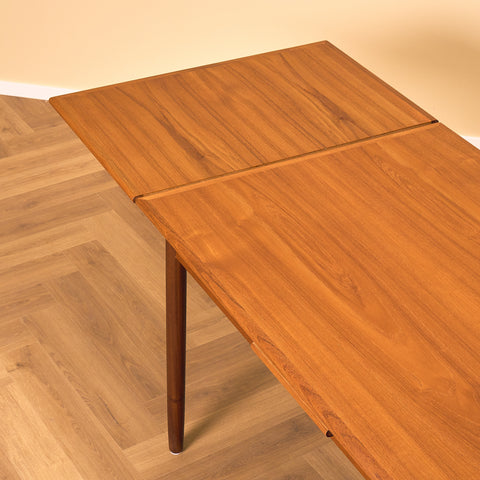 Danish dining table in teak and walnut