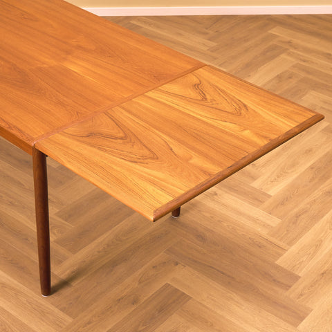Danish dining table in teak and walnut