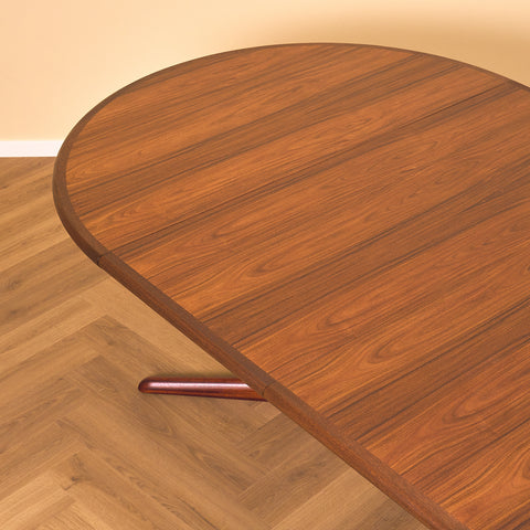Danish round dining table in walnut & mahogany by Skovby