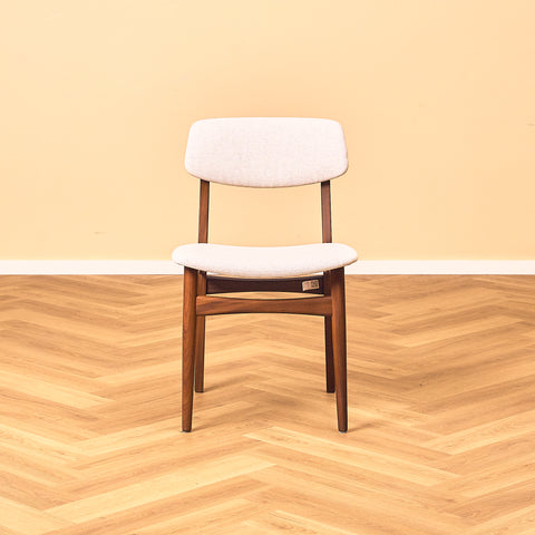 Danish dining chairs in teak and walnut by Farstrup