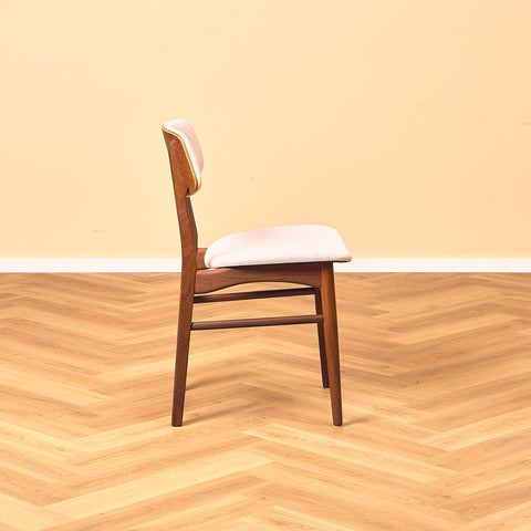 Danish dining chairs in teak and walnut by Farstrup