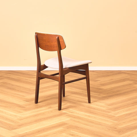 Danish dining chairs in teak and walnut by Farstrup