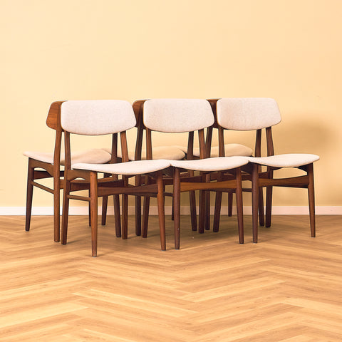 Danish dining chairs in teak and walnut by Farstrup