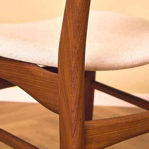 Danish dining chairs in teak and walnut by Farstrup