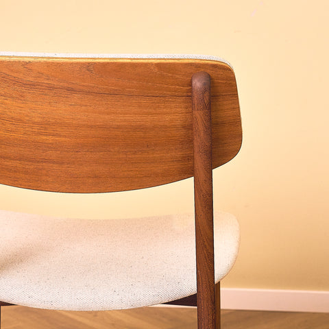 Danish dining chairs in teak and walnut by Farstrup
