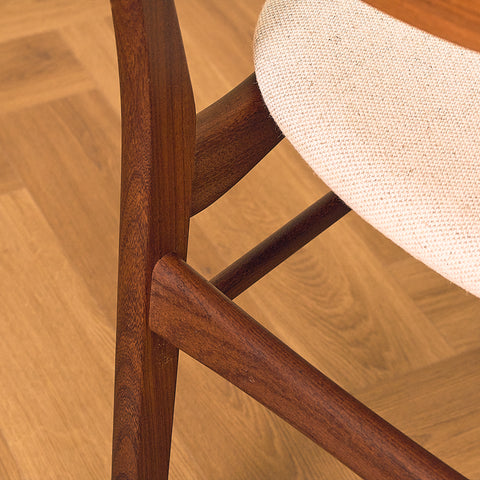 Danish dining chairs in teak and walnut by Farstrup