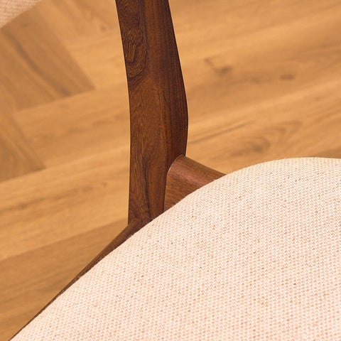 Danish dining chairs in teak and walnut by Farstrup