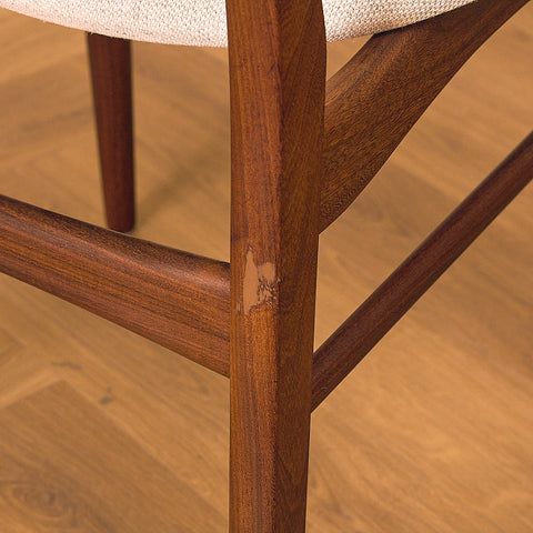 Danish dining chairs in teak and walnut by Farstrup