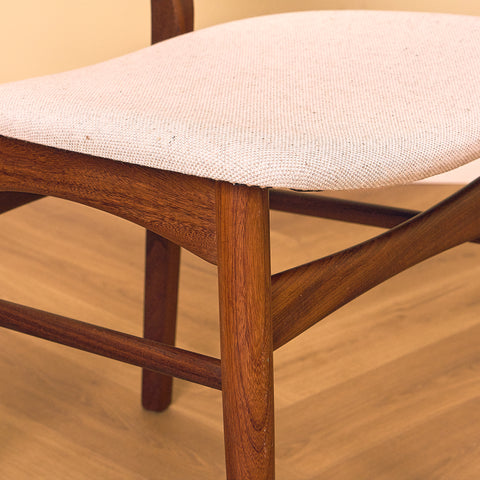 Danish dining chairs in teak and walnut by Farstrup