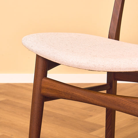 Danish dining chairs in teak and walnut by Farstrup