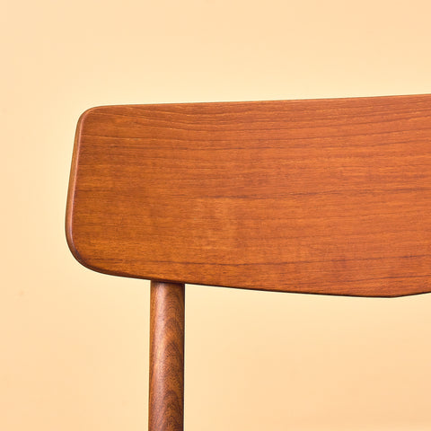 Danish dining chairs in teak & walnut by Farstrup