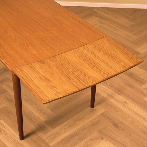 Danish rectangular dining table in teak and walnut