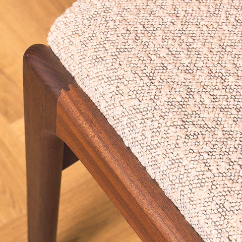 Erik Buch Model 89 Dining Chair in Walnut and Bouclé, close-up of the seat rail in walnut