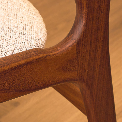 Erik Buch Model 89 Dining Chair in Walnut and Bouclé, close-up of the rear leg joint in walnut