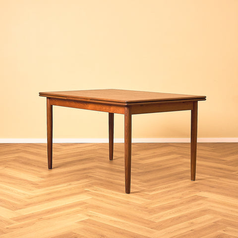 Danish dining table in teak and walnut