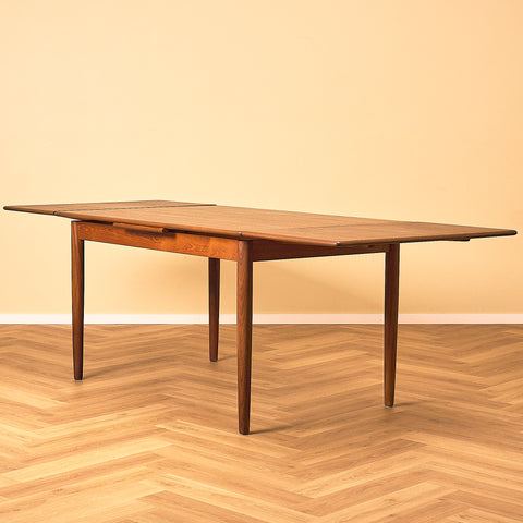 Danish dining table in teak and walnut