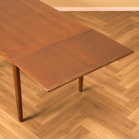 Danish dining table in teak and walnut