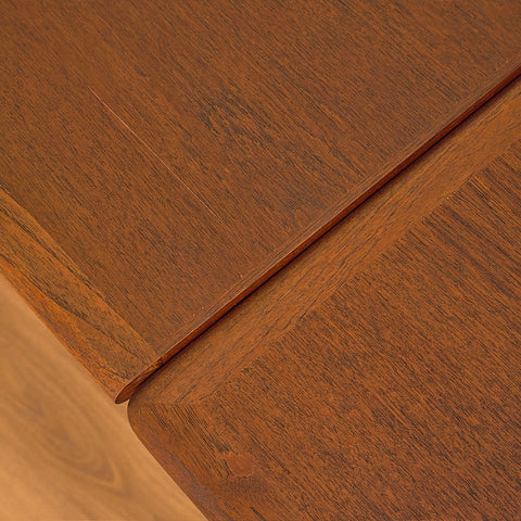 Danish dining table in teak and walnut