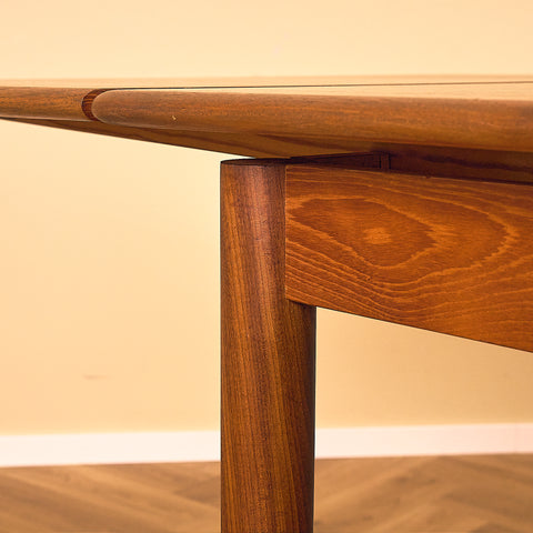 Danish dining table in teak and walnut