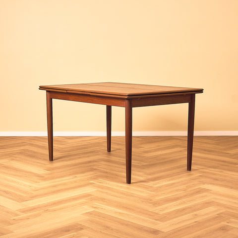 Danish dining table in teak and walnut