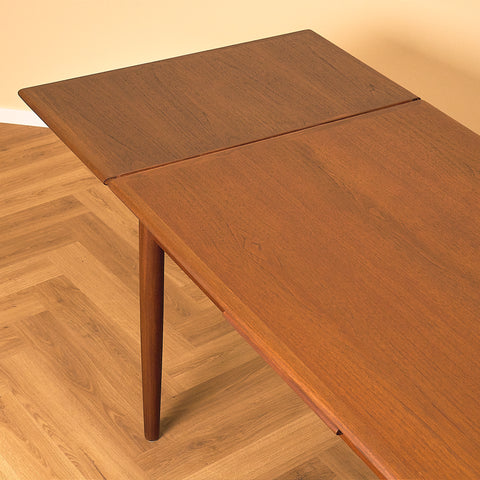 Danish dining table in teak and walnut