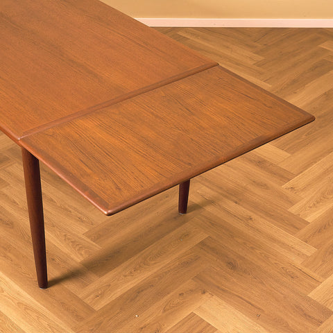 Danish dining table in teak and walnut