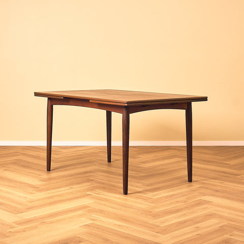 Danish dining table in teak and walnut