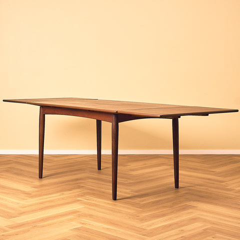 Danish dining table in teak and walnut