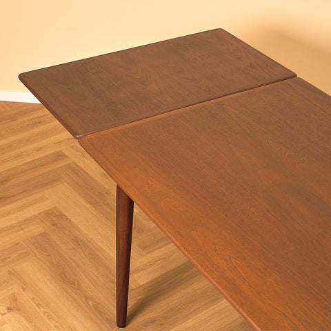 Danish dining table in teak and walnut