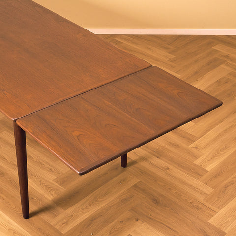 Danish dining table in teak and walnut