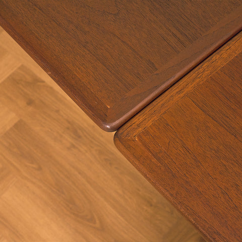 Danish dining table in teak and walnut