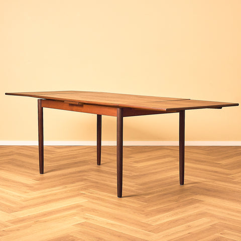 Danish dining table in teak and walnut