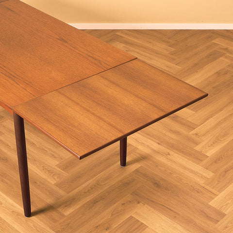 Danish dining table in teak and walnut
